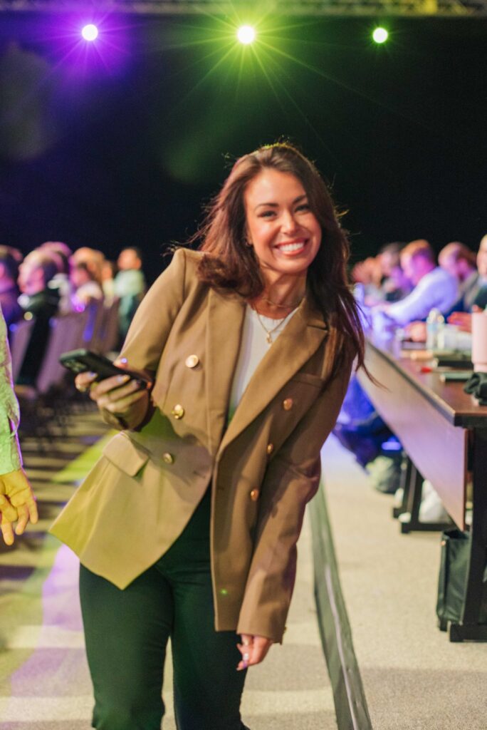 woman posing for a photo at a conference