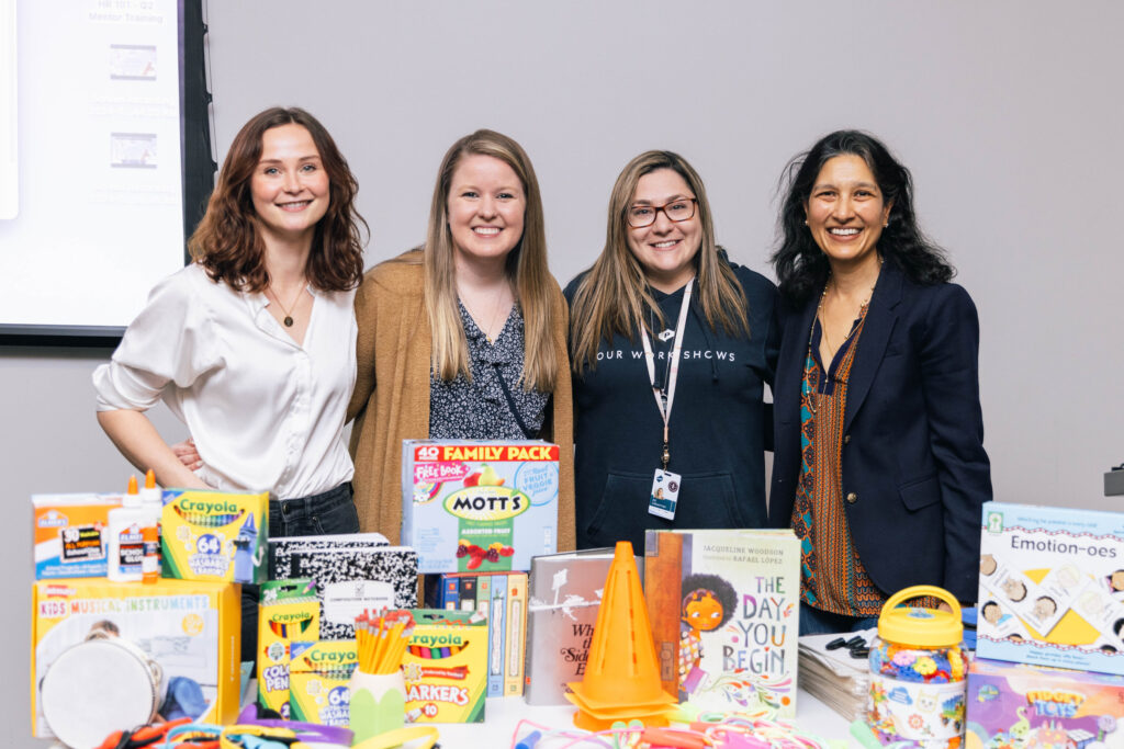 POWER employees interact with supplies for teachers.