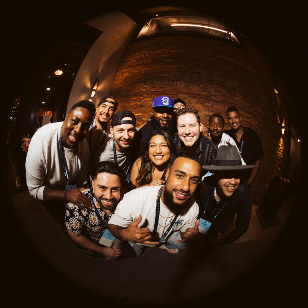 employees pose for group photo at event